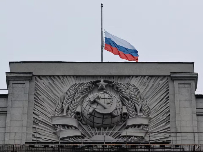 A Russian national flag is seen lowered on the headquarters of State Duma, the lower house of parliament, on the day of mourning, declared following a deadly shooting in the Crocus City Hall concert hall, in Moscow, Russia March 24, 2024. REUTERS/Shamil Zhumatov Purchase Licensing Rights