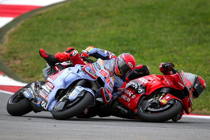 LAGOA, ALGARVE, PORTUGAL - MARCH 24: Francesco Bagnaia of Ducati Team and Italy and Marc Marquez of Gresini Racing and Spain crash during the Race of the MotoGP Of Portugal at Autodromo do Algarve on March 24, 2024 in Lagoa, Algarve, Portugal. (Photo by Diogo Cardoso/DeFodi Images via Getty Images)