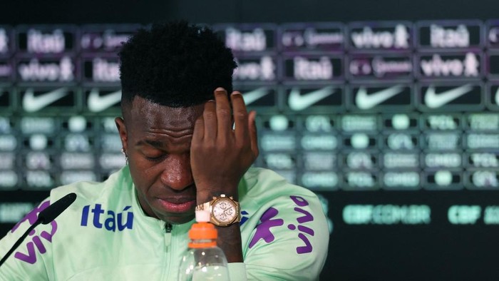 Brazils forward Vinicius Junior cries as he gives a press conference on the eve of the international friendly football match between Spain and Brazil at the Ciudad Real Madrid training ground in Valdebebas, outskirts of Madrid, on March 25, 2024. Spain arranged a friendly against Brazil at the Santiago Bernabeu under the slogan One Skin to help combat racism. (Photo by Pierre-Philippe MARCOU / AFP)