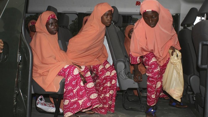 Kaduna state governor, Sani Uba, shakes hands with the freed students of the LEA Primary and Secondary School Kuriga upon their arrival at the state government house in Kaduna, Nigeria, Monday, March 25, 2024. More than 130 Nigerian schoolchildren rescued after more than two weeks in captivity have arrived in their home state in northwestern Nigeria ahead of their anticipated reunions with families. (AP Photo/Olalekan Richard)