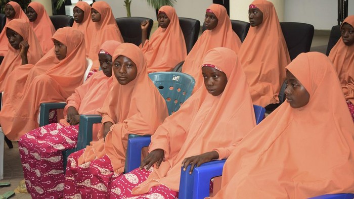 Kaduna state governor, Sani Uba, shakes hands with the freed students of the LEA Primary and Secondary School Kuriga upon their arrival at the state government house in Kaduna, Nigeria, Monday, March 25, 2024. More than 130 Nigerian schoolchildren rescued after more than two weeks in captivity have arrived in their home state in northwestern Nigeria ahead of their anticipated reunions with families. (AP Photo/Olalekan Richard)