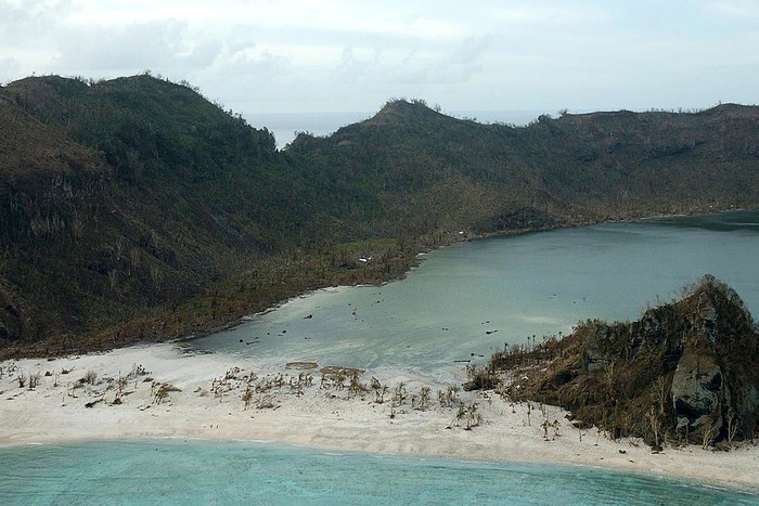 TIKOPIA ISLAND - JANUARY 2:  One of several villages on the remote island of Tikopia is shown January 2, 2003 which is part of the Temotu Province of the Solomon Islands. Approximately 3,700 South Pacific islanders were affected by Cyclone Zoe when it hit the area December 29, 2002 damaging trees, village huts as well as island communications. Aid officials recently flew over the areas hit by the storm and saw signs of normal life. However, official storm aid is still a few days away.  (Photo by Andy Hall/Australian Defense Force/Getty Images)