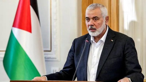 Ismail Haniyeh, the Doha-based political bureau chief of the Palestinian group Hamas, speaks to the press after a meeting with the Iranian foreign minister in Tehran on March 26, 2024. (AFP)