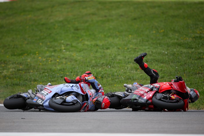 LAGOA, ALGARVE, PORTUGAL - MARCH 24: Francesco Bagnaia of Ducati Team and Italy and Marc Marquez of Gresini Racing and Spain crash during the Race of the MotoGP Of Portugal at Autodromo do Algarve on March 24, 2024 in Lagoa, Algarve, Portugal. (Photo by Diogo Cardoso/DeFodi Images via Getty Images)