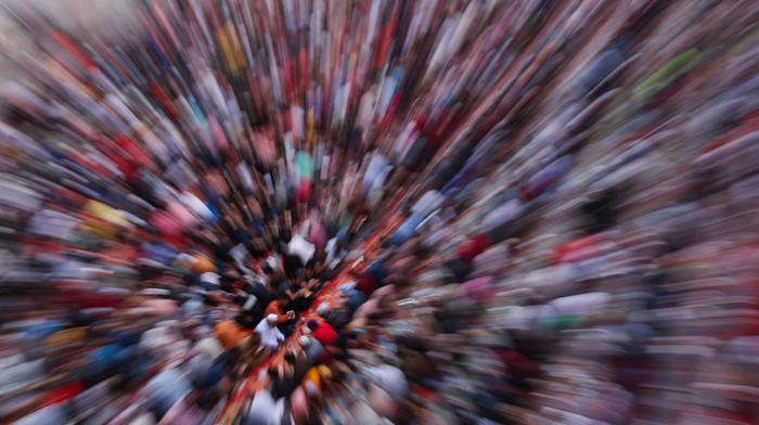 Muslims pray at charity Iftar camp, with workers housings visible in the background, during the Muslim holy month of Ramadan in Dubai, United Arab Emirates, March 26, 2024. REUTERS/Amr Alfiky