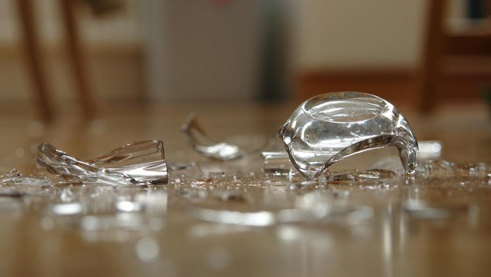 Glass has fallen on the floor and broke up. Very shallow DOF.