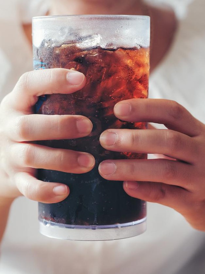 903780304 Woman hand giving glass ,Soft drinks with ice, sweethart or buddy