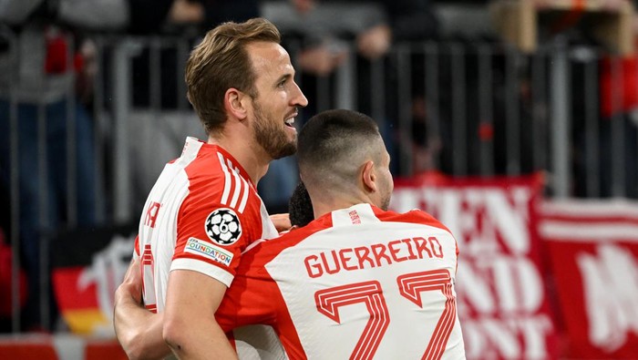 05 March 2024, Bavaria, Munich: Soccer: Champions League, FC Bayern Munich - Lazio Rome, knockout round, round of 16, second leg, Allianz Arena. Munichs Harry Kane (l) celebrates with Munichs Raphael Guerreiro after his goal to make it 3-0. Photo: Sven Hoppe/dpa (Photo by Sven Hoppe/picture alliance via Getty Images)