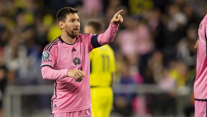 Mar 7, 2024; Nashville, TN, USA; Inter Miami forward Lionel Messi (10) points to his teammates after his goal against the Nashville SC during the second half at GEODIS Park. Mandatory Credit: Steve Roberts-USA TODAY Sports
