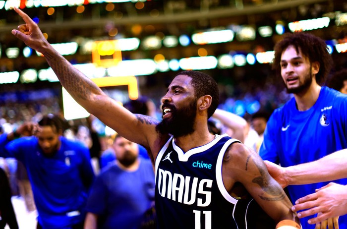 DALLAS, TX - MARCH 17: Kyrie Irving #11 of the Dallas Mavericks celebrates after hitting the game winning shot against the Denver Nuggets at American Airlines Center on March 17, 2024 in Dallas, Texas. NOTE TO USER: User expressly acknowledges and agrees that, by downloading and or using this photograph, User is consenting to the terms and conditions of the Getty Images License Agreement. (Photo by Ron Jenkins/Getty Images)