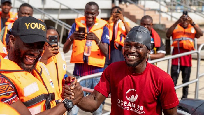 Akinrodoye Samuel jumps into the water, to start his ambitious endeavor to swim the 11.8 km stretch of the Third Mainland Bridge, advocating for the theme 'Swim Against Suicide And Depression' in Lagos, Nigeria, March 30, 2024. REUTERS/Marvellous Durowaiye