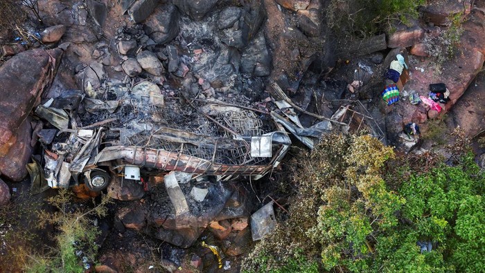 A view of the burnt remains of the bus that was taking Easter pilgrims from Botswana to Moria, following its crash near Mamatlakala in the northern province of Limpopo, South Africa March 29, 2024. REUTERS/Siphiwe Sibeko     TPX IMAGES OF THE DAY