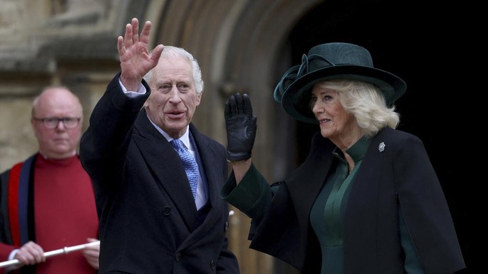 Britains King Charles III and Queen Camilla greet people after attending the Easter Matins Service at St. Georges Chapel, Windsor Castle, England, Sunday, March 31, 2024. (Hollie Adams/Pool Photo via AP)