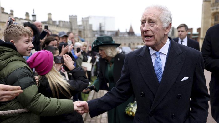 Britains King Charles III and Queen Camilla greet people after attending the Easter Matins Service at St. Georges Chapel, Windsor Castle, England, Sunday, March 31, 2024. (Hollie Adams/Pool Photo via AP)