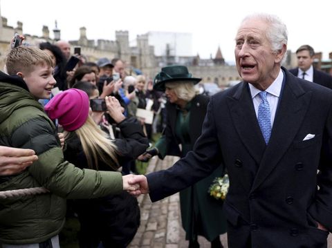 Momen Kemunculan Raja Charles III Setelah Didiagnosis Kanker Britain's King Charles III and Queen Camilla greet people after attending the Easter Matins Service at St. George's Chapel, Windsor Castle, England, Sunday, March 31, 2024. (Hollie Adams/Pool Photo via AP)