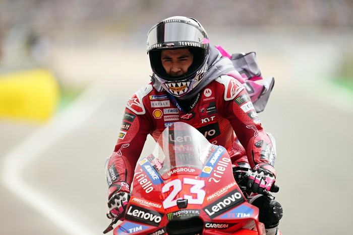 MotoGP rider Enea Bastianini of Italy rides back to the pit lane after finishing second in the Portuguese Motorcycle Grand Prix at the Algarve International circuit near Portimao, Portugal, Sunday, March 24, 2024. (AP Photo/Jose Breton)