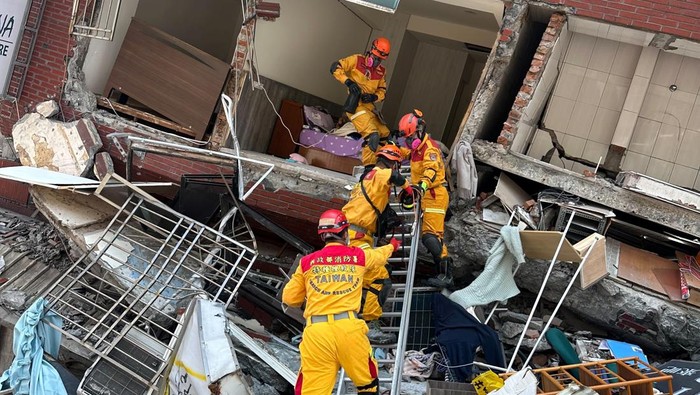 Firefighters work at the site where a building collapsed following the earthquake, in Hualien, Taiwan, in this handout provided by Taiwans National Fire Agency on April 3, 2024. Taiwan National Fire Agency/Handout via REUTERS  ATTENTION EDITORS - THIS IMAGE WAS PROVIDED BY A THIRD PARTY. NO RESALES. NO ARCHIVES.
