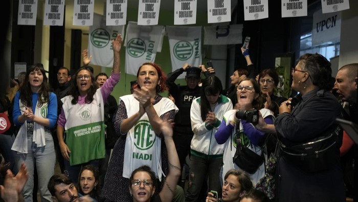 State employees enter their workplace after they were temporarily prevented from entering their workplace due to an
anti-government protest in support of workers who were laid off as part of state economic downsizing measures, in Buenos Aires, Argentina, Wednesday, April 3, 2024. According to the State Workers Association, more than 11 thousand dismissals of state employees have been carried out by Javier Milei’s government. (AP Photo/Gustavo Garello)