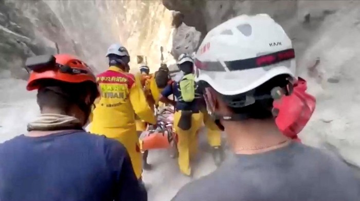 Rescuers carry a person on a stretcher, following the earthquake, in Hualien, Taiwan, April 4, 2024 in this screengrab taken from video. Kaohsiung City Fire Department/Handout via REUTERS    THIS IMAGE HAS BEEN SUPPLIED BY A THIRD PARTY