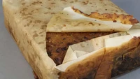 Sebuah fruit cake berusia 103 tahun ditemukan arkeolog di kawasan Antartika. Para peneliti percaya kue ini merupakan bekal seorang penjelajah Inggris bernama Robert Falcon Scott. Foto: Istimewa
