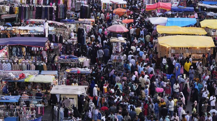 Muslims shop ahead of Eid al-Fitr in front of the Charminar monument in Hyderabad, India, Tuesday, April 9, 2024. Eid al-Fitr marks the end of the holy fasting month of Ramadan. (AP Photo/Mahesh Kumar A.)