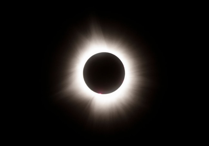 LAKE CARMI, VERMONT - APRIL 08: The moon crosses in front of the sun during the Great North American Solar Eclipse on April 08, 2024 in Lake Carmi, Vermont. Millions of people have flocked to areas across North America that are in the 