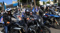 Orang-orang berpartisipasi dalam acara sepeda motor Ride for Hope, di Tel Aviv.