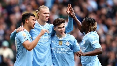 MANCHESTER, ENGLAND - APRIL 13: Erling Haaland of Manchester City celebrates with teammates after Daiki Hashioka of Luton Town (not pictured) scores an own goal, the first goal for Manchester City during the Premier League match between Manchester City and Luton Town at Etihad Stadium on April 13, 2024 in Manchester, England. (Photo by Matt McNulty/Getty Images) (Photo by Matt McNulty/Getty Images)