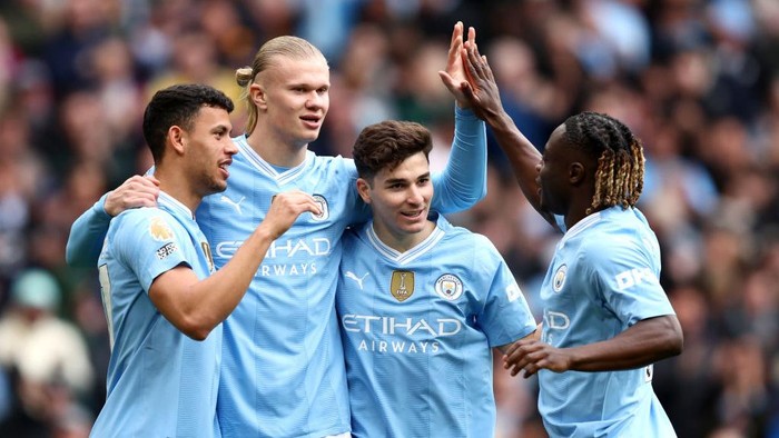 MANCHESTER, ENGLAND - APRIL 13: Erling Haaland of Manchester City celebrates with teammates after Daiki Hashioka of Luton Town (not pictured) scores an own goal, the first goal for Manchester City during the Premier League match between Manchester City and Luton Town at Etihad Stadium on April 13, 2024 in Manchester, England. (Photo by Matt McNulty/Getty Images) (Photo by Matt McNulty/Getty Images)