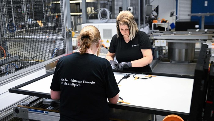 Elsa from Freiberg and Karin from Brand-Erbisdorf work on a solar module as part of the last production at the Meyer Burger Technology AG plant, which has announced closure, in Freiberg, Germany March 12, 2024. REUTERS/Annegret Hilse