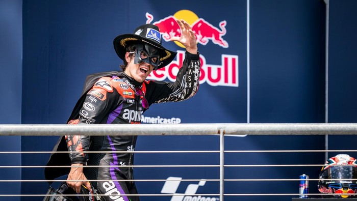 AUSTIN, TEXAS - APRIL 14: Maverick Viñales of Spain and Aprilia Racing enters the podium after his race win with Batman costume during the Race of the MotoGP Red Bull Grand Prix of The Americas at the Circuit Of The Americas on April 14, 2024 in Austin, Texas. (Photo by Steve Wobser/Getty Images)