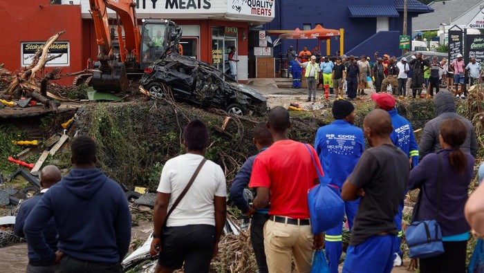 A car is pulled from a river after flooding caused extensive damage in Margate, South Africa, April 15, 2024. REUTERS/Rogan Ward
