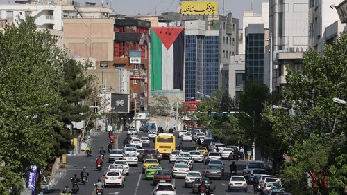 An anti-Israel billboard with a picture of Iranian missiles is seen in a street in Tehran, Iran April 15, 2024. Majid Asgaripour/WANA (West Asia News Agency) via REUTERS ATTENTION EDITORS - THIS IMAGE HAS BEEN SUPPLIED BY A THIRD PARTY.