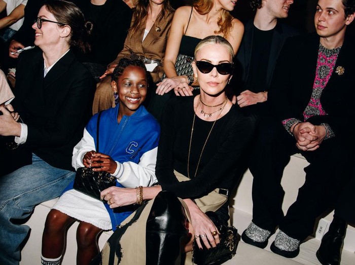 Charlize Theron, right, and daughter August attend the Dior Pre-Fall 2024 fashion show at the Brooklyn Museum on Monday, April 15, 2024, in New York. (Photo by Evan Agostini/Invision/AP)