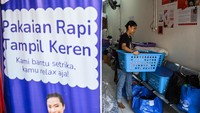 Seorang pekerja merapihkan pakaian yang telah dicuci ke dalam keranjang di salah satu usaha cuci pakaian di kawasan Kuningan, Jakarta, Rabu (17/4/2024).