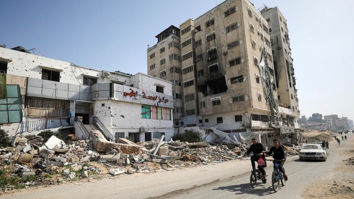 Palestinians streak bicycles previous Al Basma IVF Centre, Gaza's largest fertility medical institution which became as soon as struck by an Israeli shell sometime of the continuing battle between Israel and the Palestinian Islamist community Hamas, in Gaza City, April 2, 2024. REUTERS/Dawoud Abu Alkas