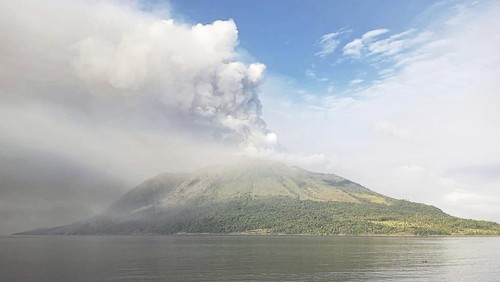 Mount Ruang volcano is seen during the eruption from Tagulandang island, Indonesia, Thursday, April 18, 2024. Indonesian authorities closed an airport and residents left homes near an erupting volcano Thursday due to the dangers of spreading ash, falling rocks, hot volcanic clouds and the possibility of a tsunami. (AP Photo/ Hendra Ambalao)