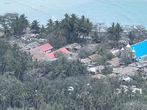 Foto Udara Permukiman Tertutup Abu Vulkanik Gunung Ruang