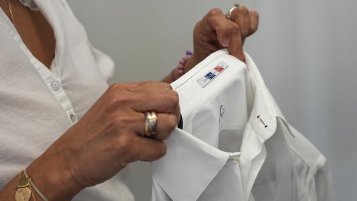 Uniforms and shoes for the Team France opening ceremony are presented at the Berluti offices in Paris, Wednesday April 10, 2024. The fashion house designed Team France's uniforms for the Paris 2024 Olympic Games opening ceremony. (AP Photo/Laurent Cipriani)