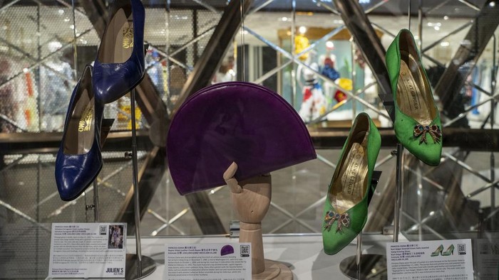 Dresses worn by Princess Diana are displayed at the media preview ahead of the auction of the Princess Diana's Elegance & A Royal Collection in Hong Kong, Wednesday, April, 17, 2024. (AP Photo/Vernon Yuen)