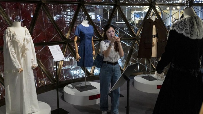 Dresses worn by Princess Diana are displayed at the media preview ahead of the auction of the Princess Diana's Elegance & A Royal Collection in Hong Kong, Wednesday, April, 17, 2024. (AP Photo/Vernon Yuen)
