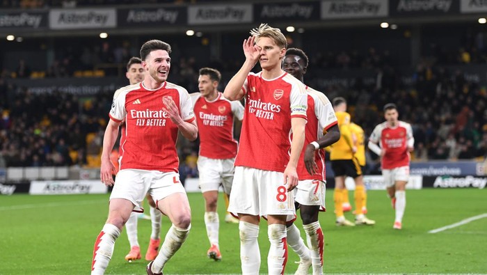 WOLVERHAMPTON, ENGLAND - APRIL 20: Martin Odegaard of Arsenal celebrates scoring his teams second goal during the Premier League match between Wolverhampton Wanderers and Arsenal FC at Molineux on April 20, 2024 in Wolverhampton, England. (Photo by Stuart MacFarlane/Arsenal FC via Getty Images)