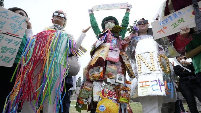 Environmentalists stage a fashion show featuring plastic wastes to mark the Earth Day in Seoul, South Korea, Monday, April 22, 2024. (AP Photo/Ahn Young-joon)