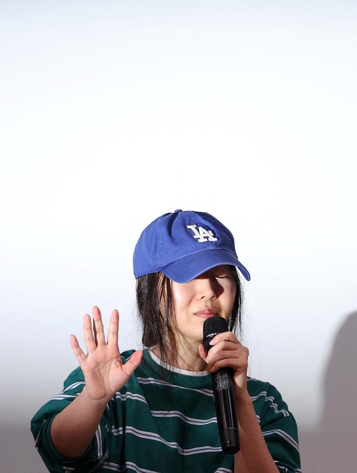 Min Hee-jin, CEO of HYBEs sub-label Ador, reacts against flashlights during a press conference in Seoul, South Korea, April 25, 2024. REUTERS/Kim Hong-Ji