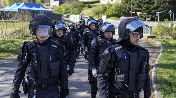Hundreds of German local state police and federal police practice tactics in preparation for the European Championship in the village of Stützerbach, in Ilmenau, Germany, Tuesday, April 23, 2024. Germany hosts the European Championship from June 14 to July 14. Security is a priority with hundreds of thousands of fans expected for the 24-country soccer tournament. (AP Photo/Ebrahim Noroozi)