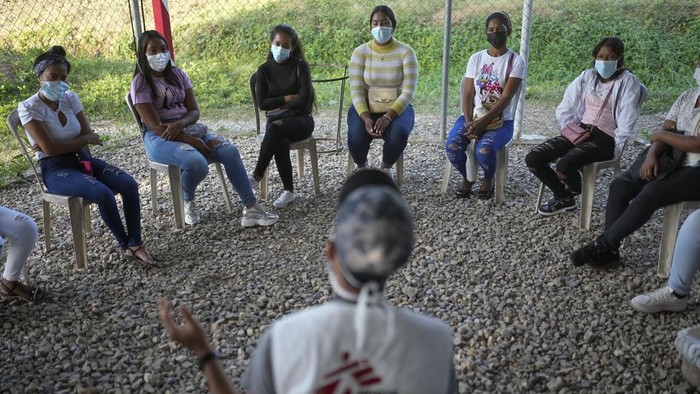 A community health worker teaches a group of women and teenage girls about contraception methods, at a Doctors Without Borders medical clinic, in Putucual, Venezuela, Wednesday, Jan. 10, 2024. The health worker also asked what they knew about HPV. (AP Photo/Matias Delacroix)