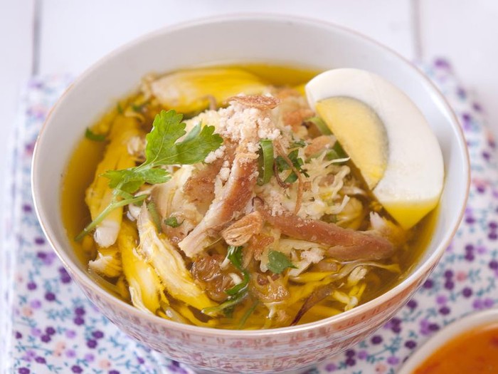 Soto ayam is a yellow spicy chicken soup with lontong or nasi empit or ketupat (all compressed rice that is then cut into small cakes) and vermicelli or noodles, commonly found in Indonesia, Singapore, and Suriname. Turmeric is added as one of its ingredients to get yellow chicken broth. It is probably the most popular variant of soto, a traditional soup commonly found in Indonesian cuisine. Besides chicken and vermicelli, it can also be served with hard-boiled eggs, slices of fried potatoes, Chinese celery leaves, and fried shallots. Occasionally, people will add 