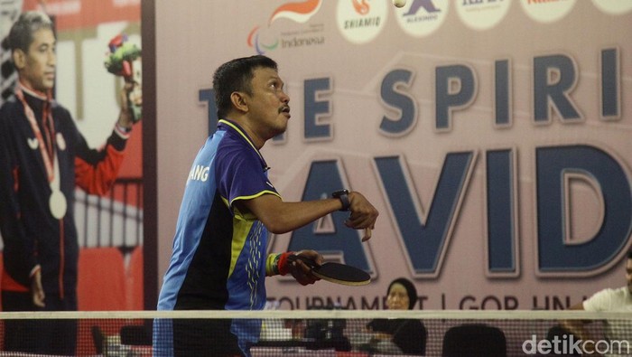 Turnamen Tenis Meja Difabel David Jacobs Turnamen tenis meja The Spirit of David Jacobs' digelar di GOR UNJ, Minggu (28/4/2024). Turnamen ini diikuti 100 peserta difabel.