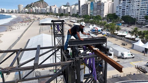 A drone view shows a worker preparing the stage for the pop star Madonna’s concert on May 4, in Copacabana beach in Rio de Janeiro, Brazil, April 20, 2024. REUTERS/Pilar Olivares REFILE - QUALITY REPEAT