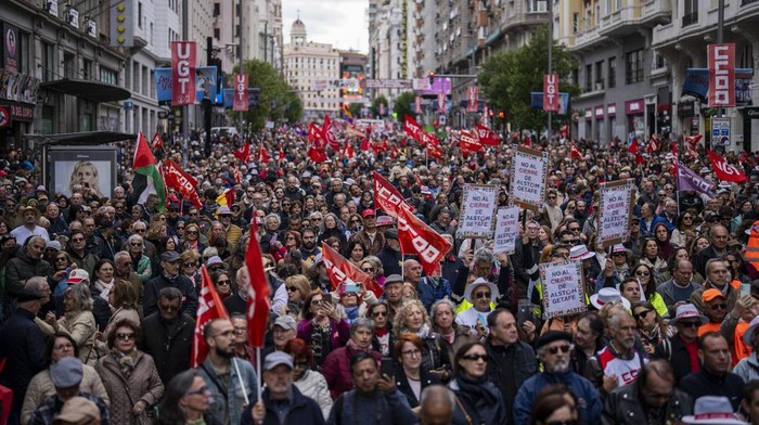 People attend a May Day rally in Madrid, Wednesday, May 1, 2024. (AP Photo/Bernat Armangue)